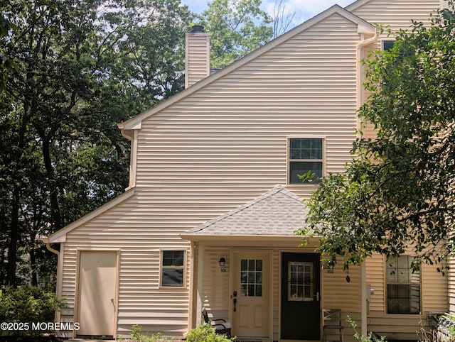 101 Begonia Ct, Jackson, NJ 08527 - rear view of property with a chimney