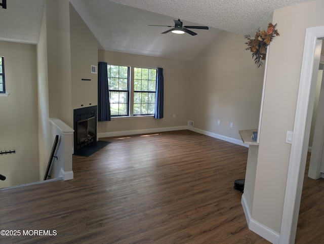 101 Begonia Ct, Jackson, NJ 08527 - unfurnished living room featuring lofted ceiling, a ceiling fan, a textured ceiling, dark wood-style floors, and a fireplace with flush hearth