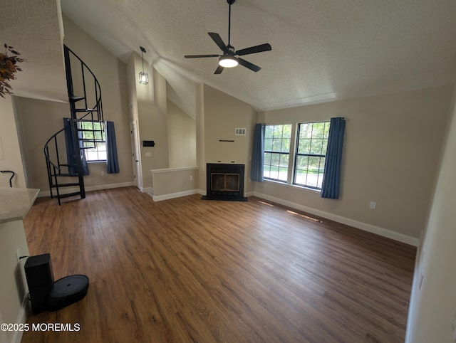 101 Begonia Ct, Jackson, NJ 08527 - unfurnished living room featuring a textured ceiling, stairs, vaulted ceiling, ceiling fan, and wood finished floors