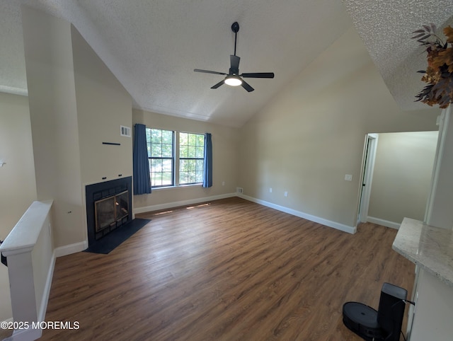 101 Begonia Ct, Jackson, NJ 08527 - unfurnished living room featuring wood finished floors, a fireplace with flush hearth, a textured ceiling, ceiling fan, and high vaulted ceiling