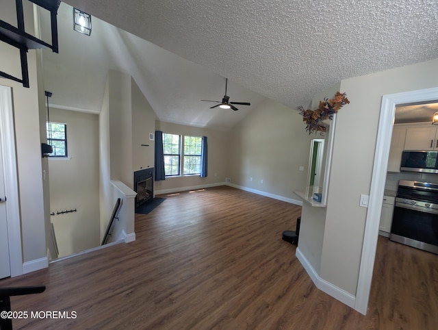 101 Begonia Ct, Jackson, NJ 08527 - unfurnished living room featuring a fireplace, ceiling fan, dark wood-style flooring, healthy amount of natural light, and a textured ceiling