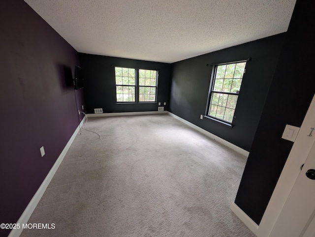 101 Begonia Ct, Jackson, NJ 08527 - unfurnished room featuring a textured ceiling, plenty of natural light, and carpet floors