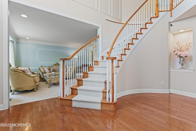 1 Hopkinson Ct, Marlboro, NJ 07746 - staircase featuring hardwood / wood-style floors, ornamental molding, recessed lighting, and a high ceiling