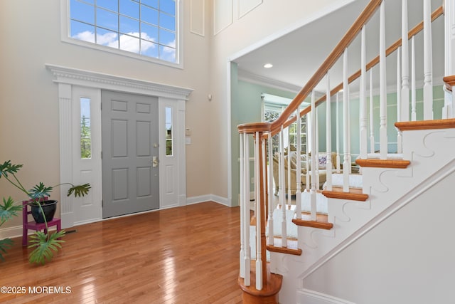 1 Hopkinson Ct, Marlboro, NJ 07746 - foyer featuring healthy amount of natural light, stairway, hardwood / wood-style floors, crown molding, and a high ceiling