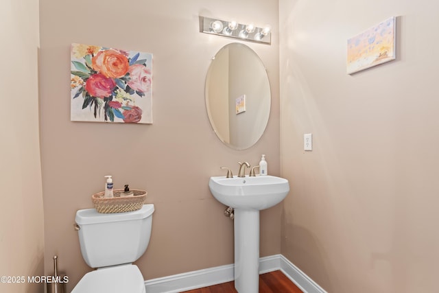 1 Hopkinson Ct, Marlboro, NJ 07746 - bathroom with toilet and wood finished floors