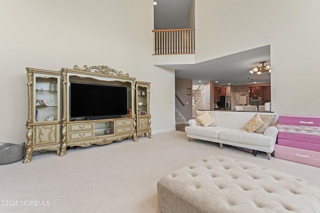 1 Hopkinson Ct, Marlboro, NJ 07746 - carpeted living area with stairway and a towering ceiling