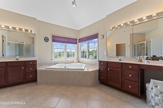 1 Hopkinson Ct, Marlboro, NJ 07746 - bathroom featuring two vanities, a shower stall, tile patterned flooring, a bath, and vaulted ceiling