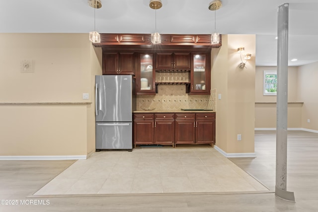 1 Hopkinson Ct, Marlboro, NJ 07746 - kitchen featuring freestanding refrigerator, decorative backsplash, pendant lighting, glass insert cabinets, and light countertops