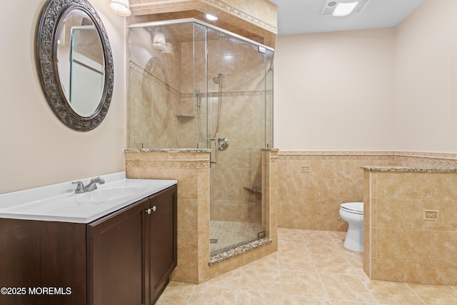 1 Hopkinson Ct, Marlboro, NJ 07746 - bathroom featuring vanity, tile walls, a shower stall, tile patterned flooring, and wainscoting