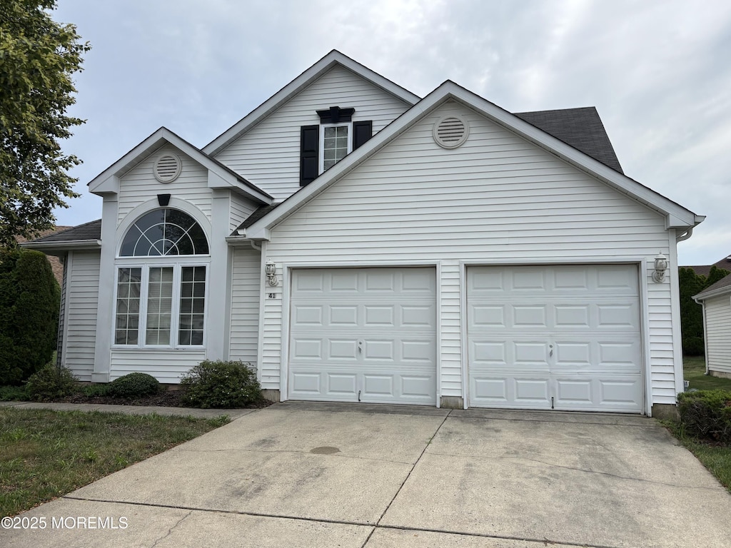 41 Dowing Ln, Jackson, NJ 08527 - traditional-style home featuring driveway and an attached garage