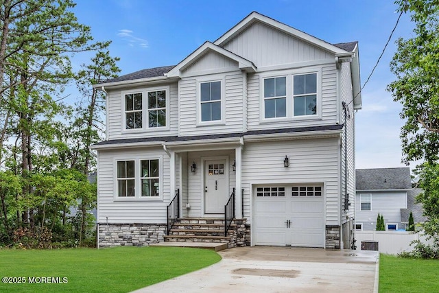 629 Monmouth Ave, Toms River, NJ 08757 - view of front of property featuring a garage, driveway, board and batten siding, and entry steps