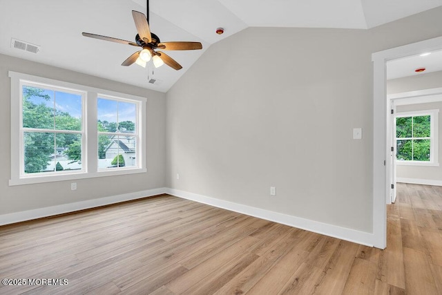 629 Monmouth Ave, Toms River, NJ 08757 - empty room featuring healthy amount of natural light, vaulted ceiling, light wood-style floors, and a ceiling fan