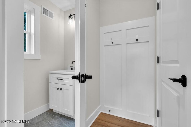 629 Monmouth Ave, Toms River, NJ 08757 - mudroom featuring baseboards and a sink