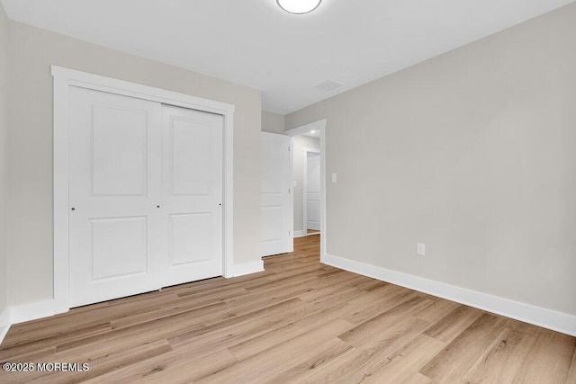 629 Monmouth Ave, Toms River, NJ 08757 - unfurnished bedroom with light wood-style flooring and a closet