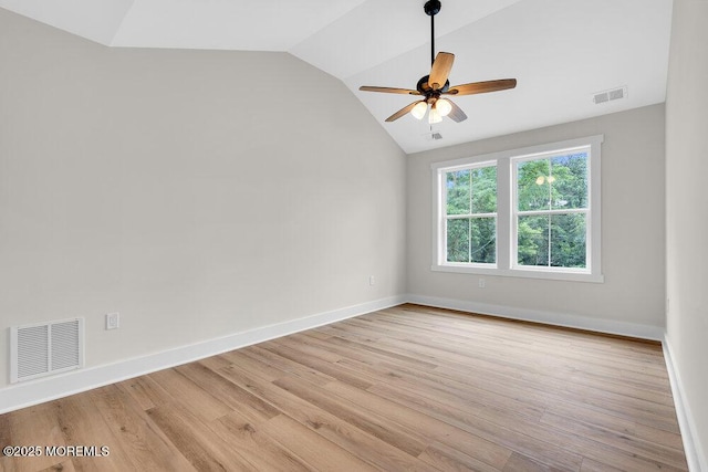 629 Monmouth Ave, Toms River, NJ 08757 - empty room with lofted ceiling, ceiling fan, and light wood finished floors