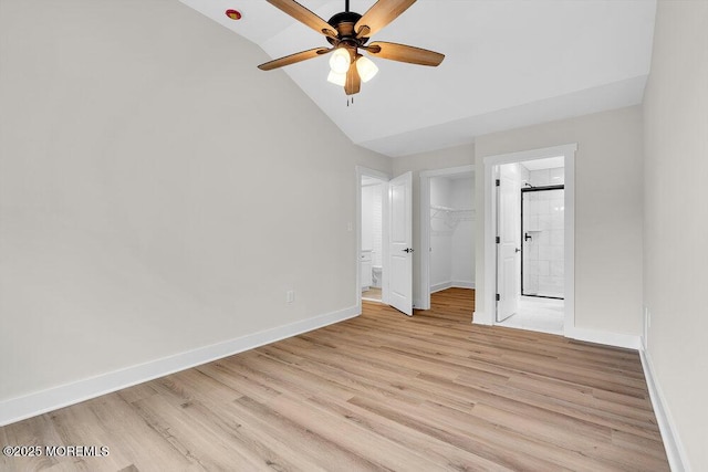 629 Monmouth Ave, Toms River, NJ 08757 - unfurnished bedroom with a walk in closet, ensuite bathroom, light wood-style floors, high vaulted ceiling, and a ceiling fan