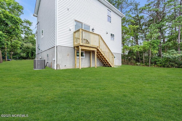 629 Monmouth Ave, Toms River, NJ 08757 - rear view of house with stairs, a lawn, and a wooden deck
