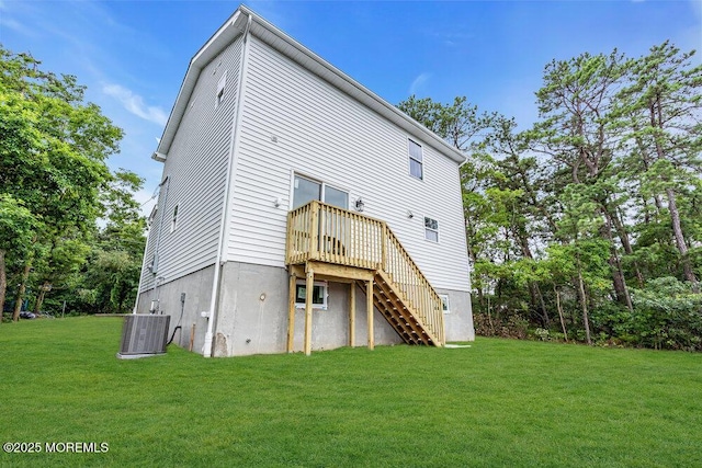 629 Monmouth Ave, Toms River, NJ 08757 - rear view of house featuring stairway, a yard, and a wooden deck