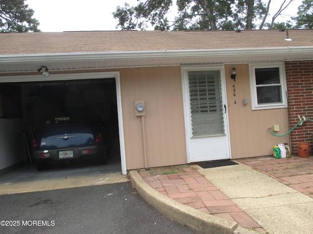 496A Thornbury Ct, Lakewood, NJ 08701 - property entrance with a garage and driveway