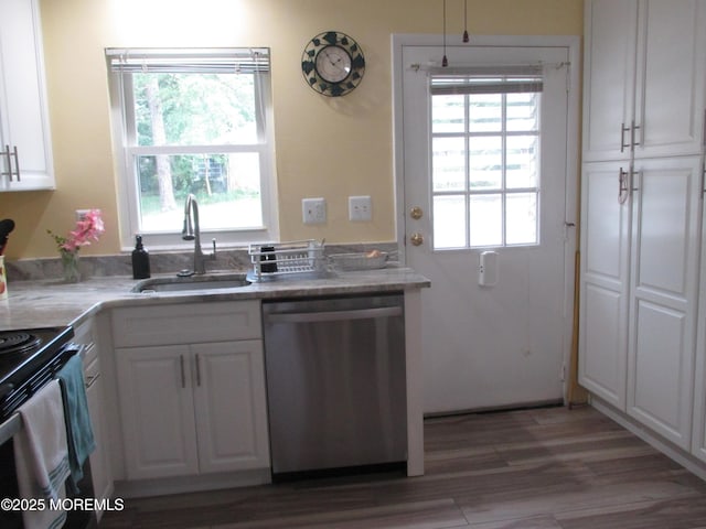 496A Thornbury Ct, Lakewood, NJ 08701 - kitchen with dishwasher, white cabinetry, wood finished floors, black range with electric stovetop, and light stone countertops