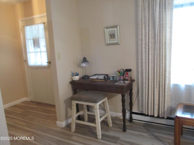 496A Thornbury Ct, Lakewood, NJ 08701 - foyer with wood finished floors and a baseboard heating unit