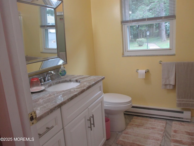 496A Thornbury Ct, Lakewood, NJ 08701 - half bathroom featuring a baseboard heating unit, vanity, and tile patterned floors