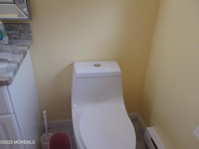 496A Thornbury Ct, Lakewood, NJ 08701 - half bath with toilet and a baseboard heating unit
