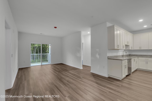 750 Lighthouse Dr Unit 1306, Barnegat, NJ 08005 - kitchen with dishwasher, open floor plan, light wood-style floors, recessed lighting, and light stone counters