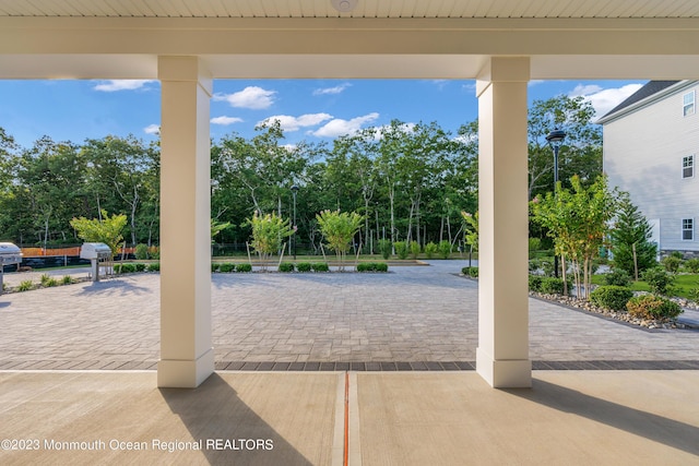 750 Lighthouse Dr Unit 1306, Barnegat, NJ 08005 - view of patio featuring view of wooded area
