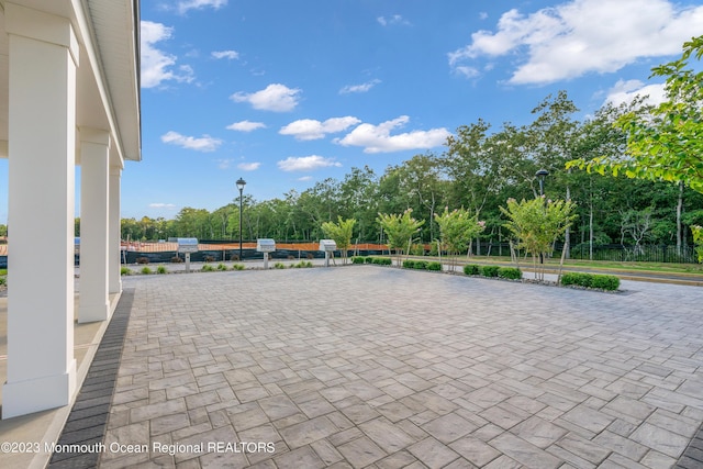 750 Lighthouse Dr Unit 1306, Barnegat, NJ 08005 - view of patio / terrace with view of wooded area
