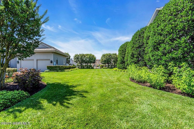 787 Princeton Ave, Brick, NJ 08724 - view of grassy yard featuring a garage