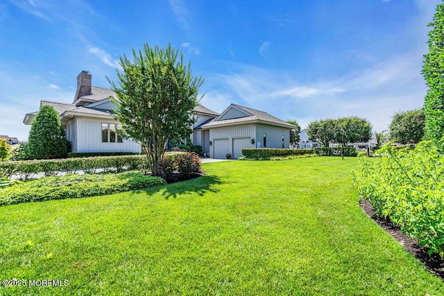 787 Princeton Ave, Brick, NJ 08724 - view of green lawn featuring a garage and driveway