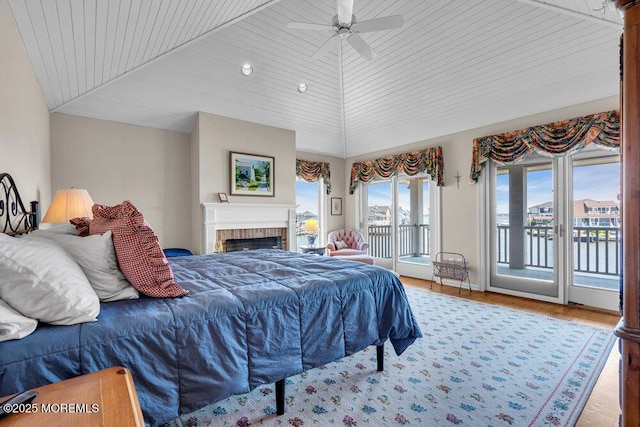 787 Princeton Ave, Brick, NJ 08724 - bedroom featuring access to outside, lofted ceiling, a fireplace, wood ceiling, and wood finished floors