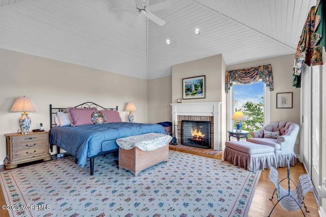 787 Princeton Ave, Brick, NJ 08724 - bedroom with light wood-style floors, a brick fireplace, ceiling fan, and vaulted ceiling