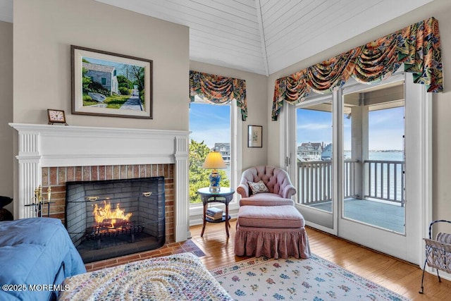 787 Princeton Ave, Brick, NJ 08724 - living area featuring a fireplace, a water view, and wood finished floors