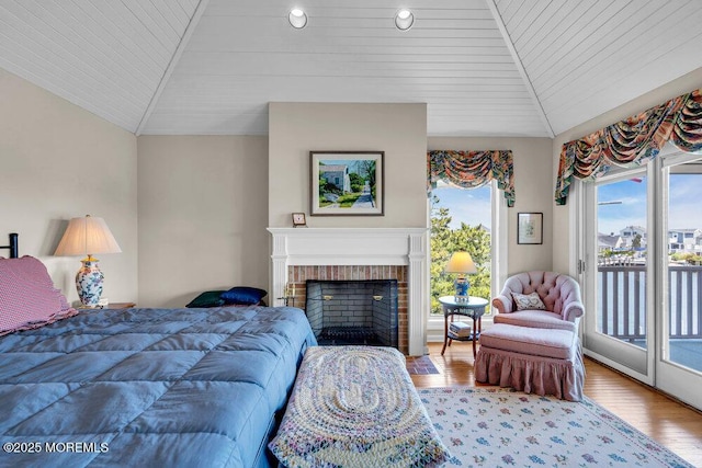 787 Princeton Ave, Brick, NJ 08724 - bedroom featuring access to exterior, wood finished floors, wooden ceiling, vaulted ceiling, and a brick fireplace