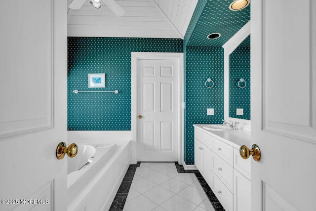 787 Princeton Ave, Brick, NJ 08724 - bathroom featuring vanity, a bath, wallpapered walls, tile patterned flooring, and inlaid floor details