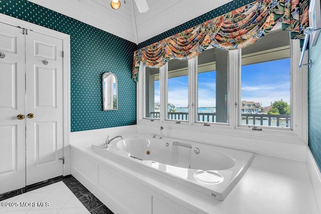 787 Princeton Ave, Brick, NJ 08724 - bathroom featuring a whirlpool tub, a water view, tile patterned floors, and wallpapered walls
