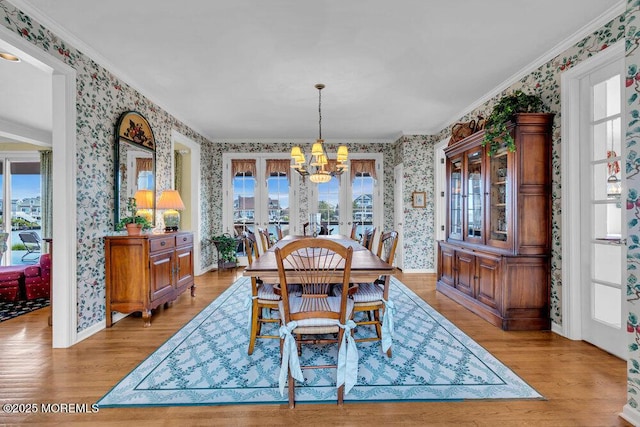 787 Princeton Ave, Brick, NJ 08724 - dining area with wallpapered walls, a chandelier, light wood-type flooring, and ornamental molding