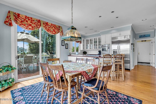 787 Princeton Ave, Brick, NJ 08724 - dining room with crown molding, a chandelier, and light wood finished floors