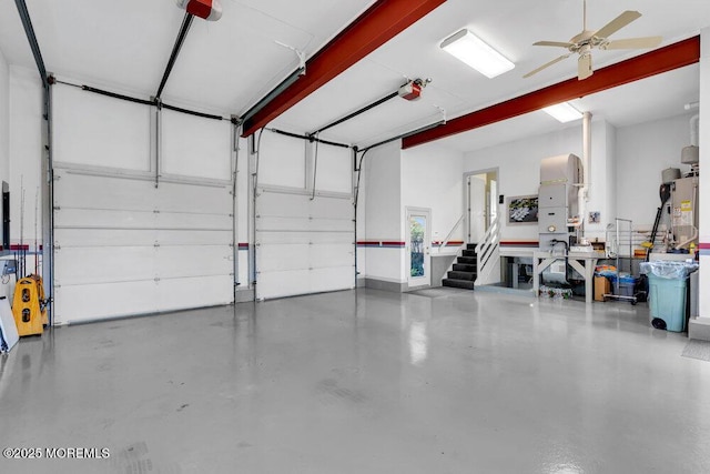 787 Princeton Ave, Brick, NJ 08724 - garage with gas water heater, a garage door opener, and ceiling fan