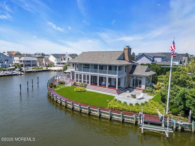 787 Princeton Ave, Brick, NJ 08724 - rear view of house featuring a balcony, a patio area, a water view, a shingled roof, and a chimney