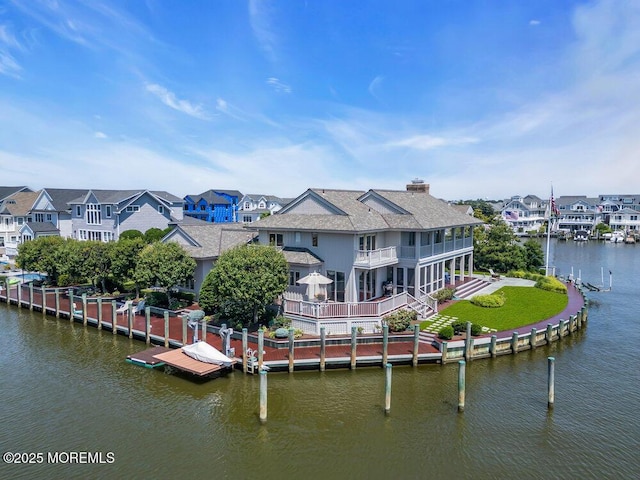 787 Princeton Ave, Brick, NJ 08724 - rear view of house with a water view, roof with shingles, a residential view, a balcony, and a chimney