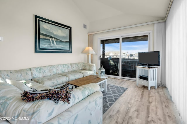 2108 SE Central Ave Unit 10, South Seaside Park, NJ 08752 - living area with lofted ceiling and wood finished floors