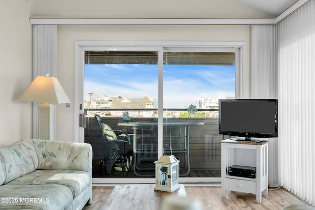 2108 SE Central Ave Unit 10, South Seaside Park, NJ 08752 - living area with wood finished floors, healthy amount of natural light, and lofted ceiling