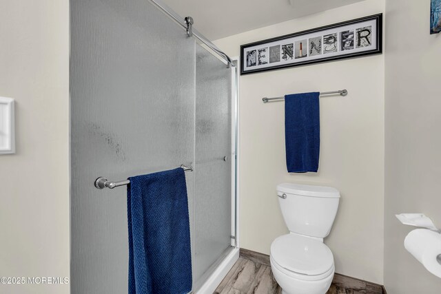 2108 SE Central Ave Unit 10, South Seaside Park, NJ 08752 - bathroom featuring a shower stall and wood finished floors