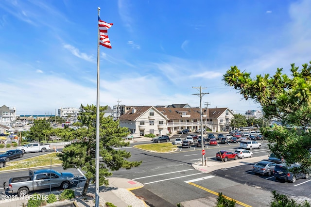 2108 SE Central Ave Unit 10, South Seaside Park, NJ 08752 - view of asphalt street with curbs, sidewalks, street lighting, and traffic signs
