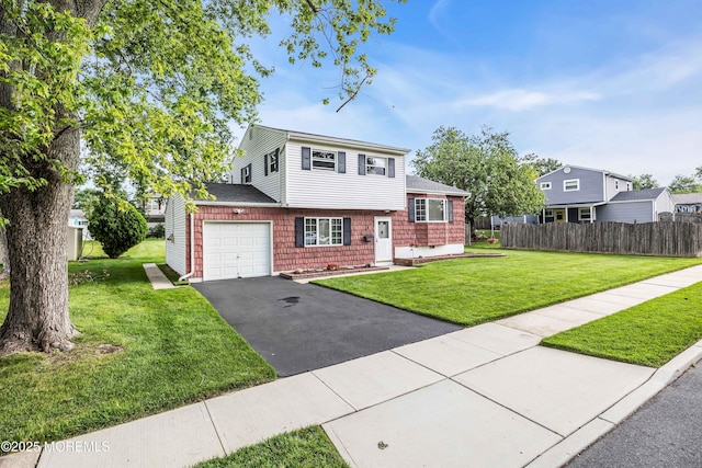 3 Colorado Dr, Hazlet, NJ 07730 - split level home featuring asphalt driveway, an attached garage, and roof with shingles