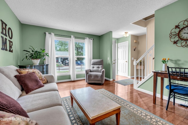 1914 Oak Dale Rd, Toms River, NJ 08753 - living area with stairs, a textured ceiling, and wood finished floors
