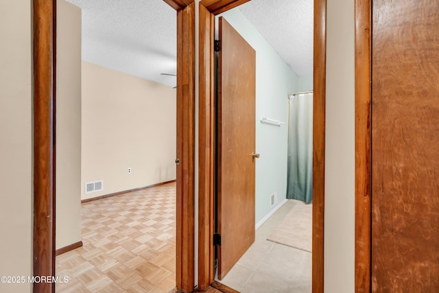 1914 Oak Dale Rd, Toms River, NJ 08753 - corridor with a textured ceiling and baseboards